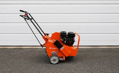 Aerator - Husqvarna concrete saw on asphalt