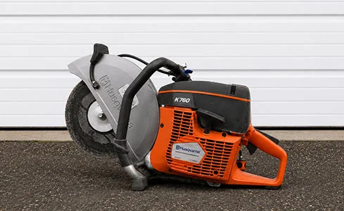 Cut-n-Break - Husqvarna K760 power cutter on asphalt
