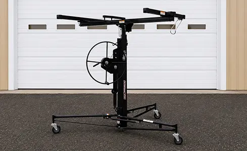 Drywall Panel Hoist - Industrial drywall hoist on asphalt