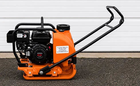 Plate Compactor - Orange plate compactor on asphalt