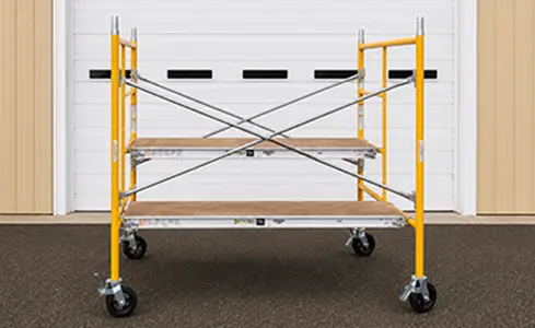 Scaffolding - Yellow scaffold in front of warehouse door